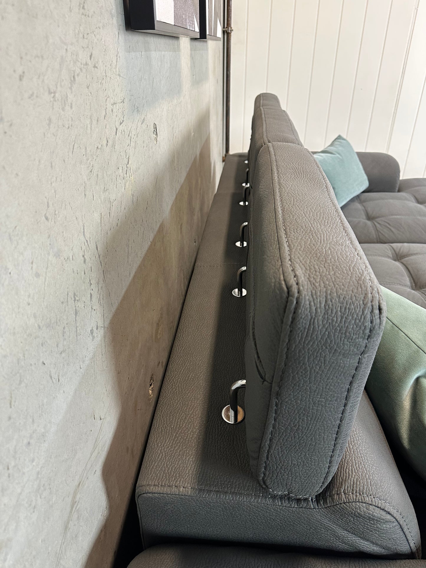 Grey Sofabed couch with adjustable headrests