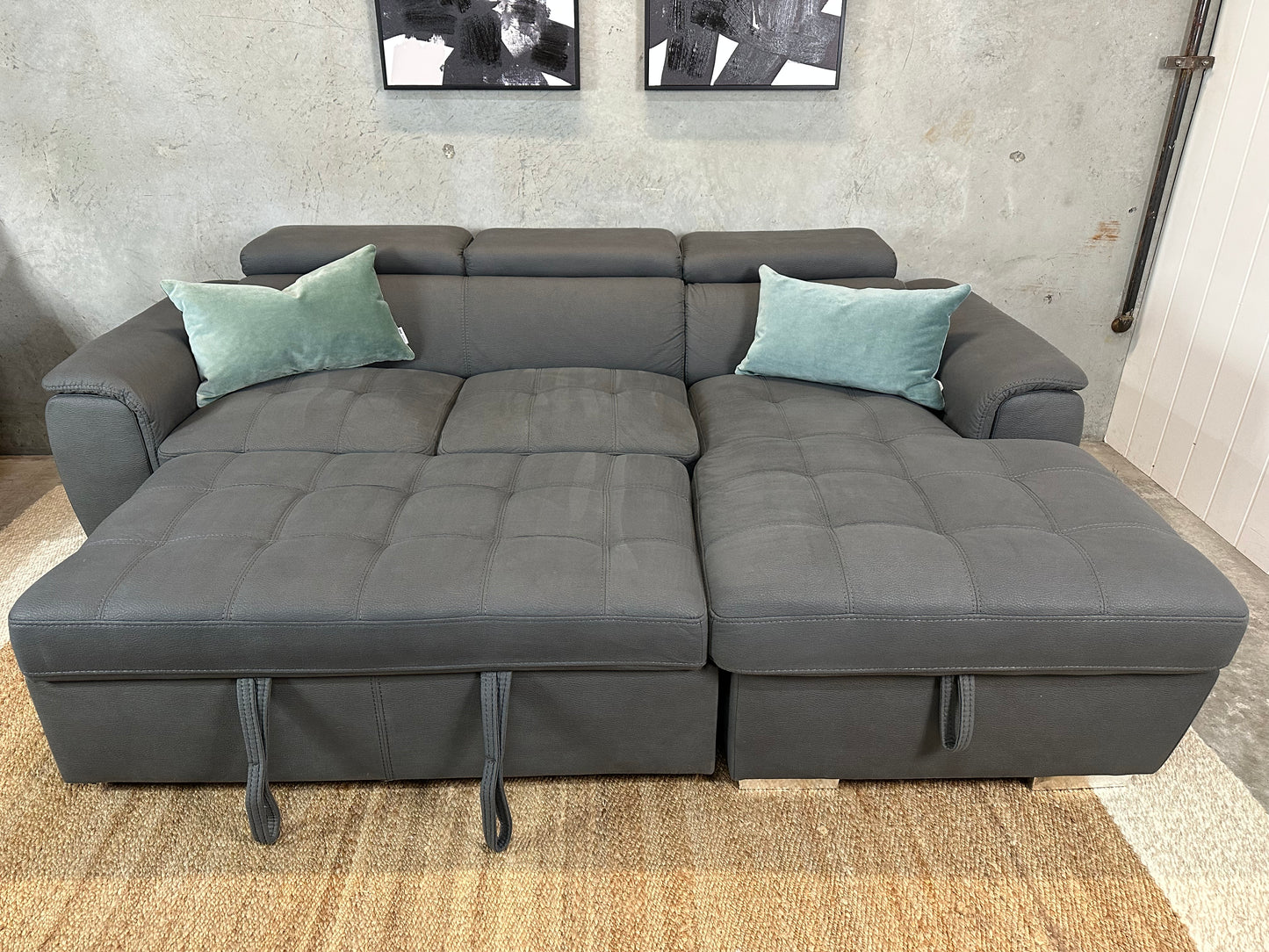 Grey Sofabed couch with adjustable headrests