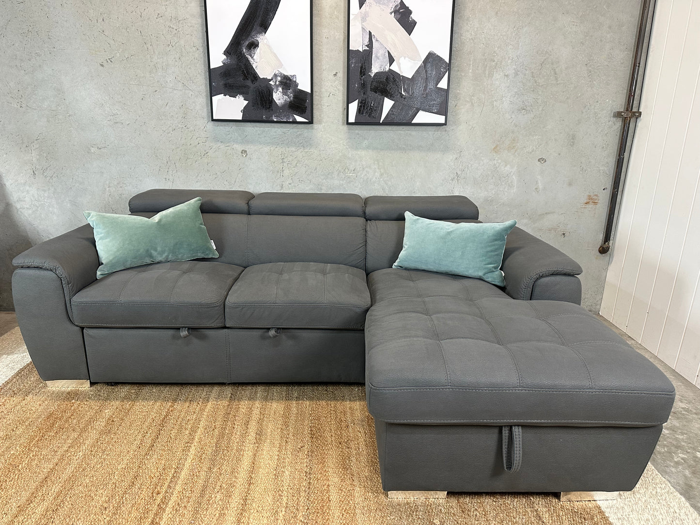 Grey Sofabed couch with adjustable headrests