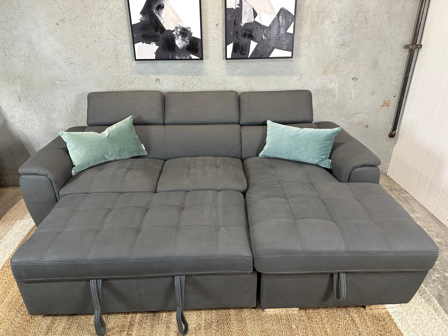 Grey Sofabed couch with adjustable headrests