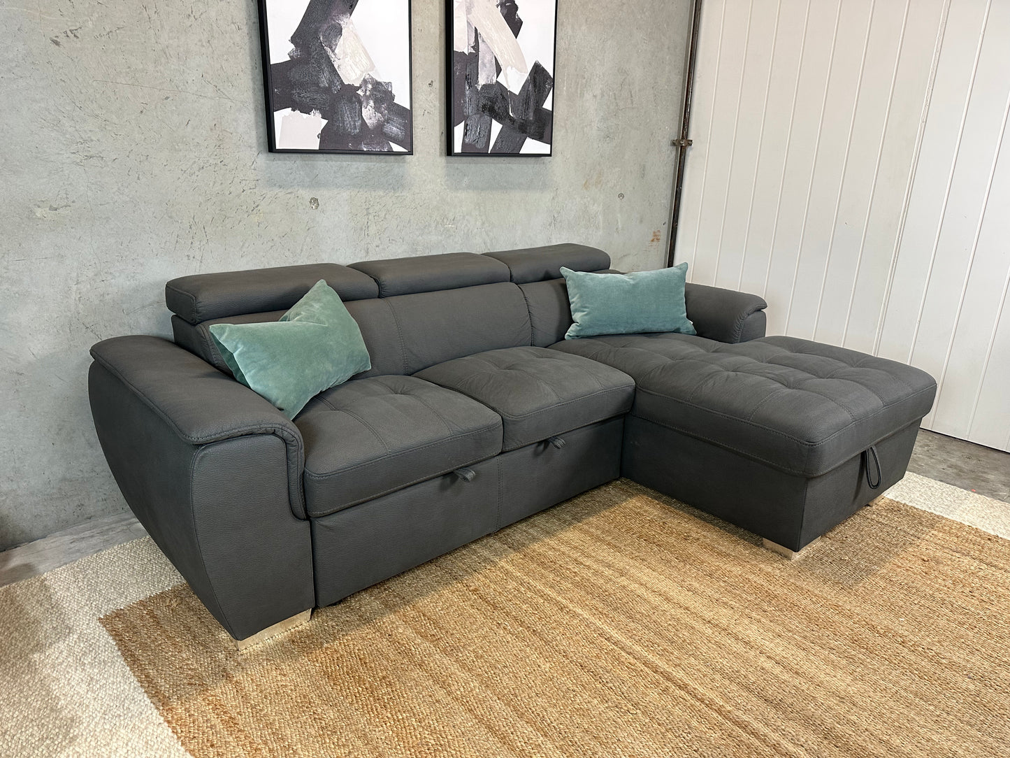 Grey Sofabed couch with adjustable headrests